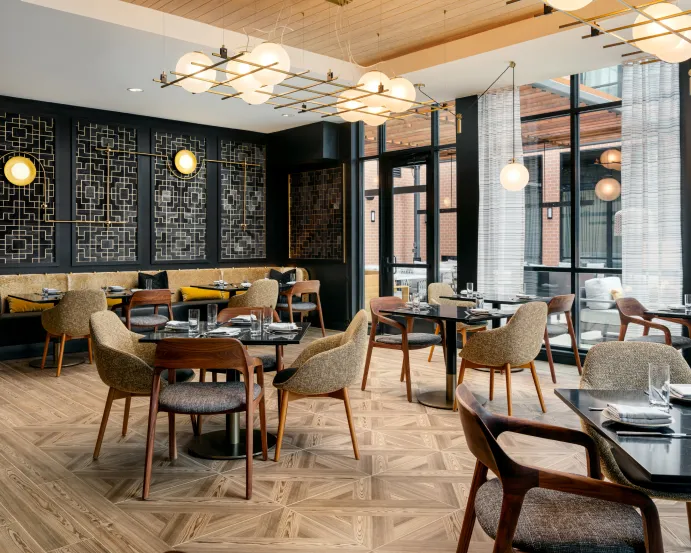 Duchess at The Nobleman Dining Room with Floor to Ceiling Windows and Modern Decor in Fort Worth, TX.